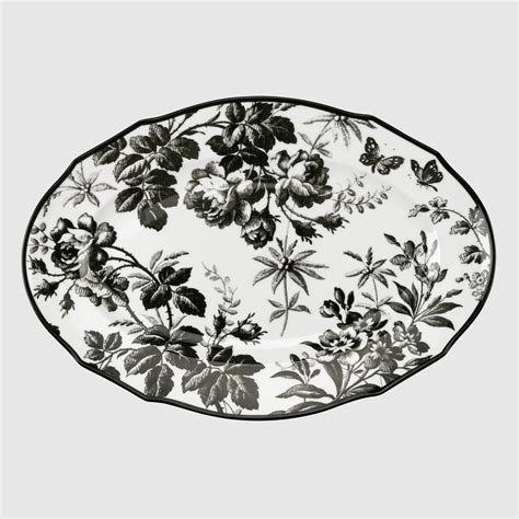 Herbarium oval tray in black and white porcelain .